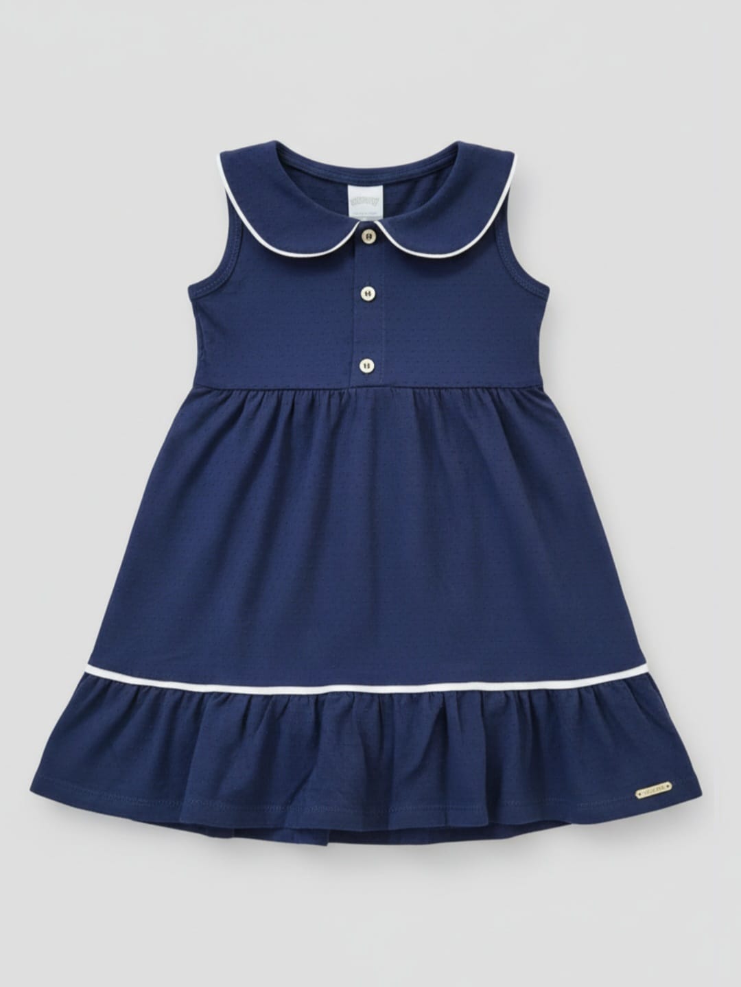 Vestido Action Infantil em Malha Nikko com Gola e Botões – Conforto, Estilo e Delicadeza para o Dia a Dia