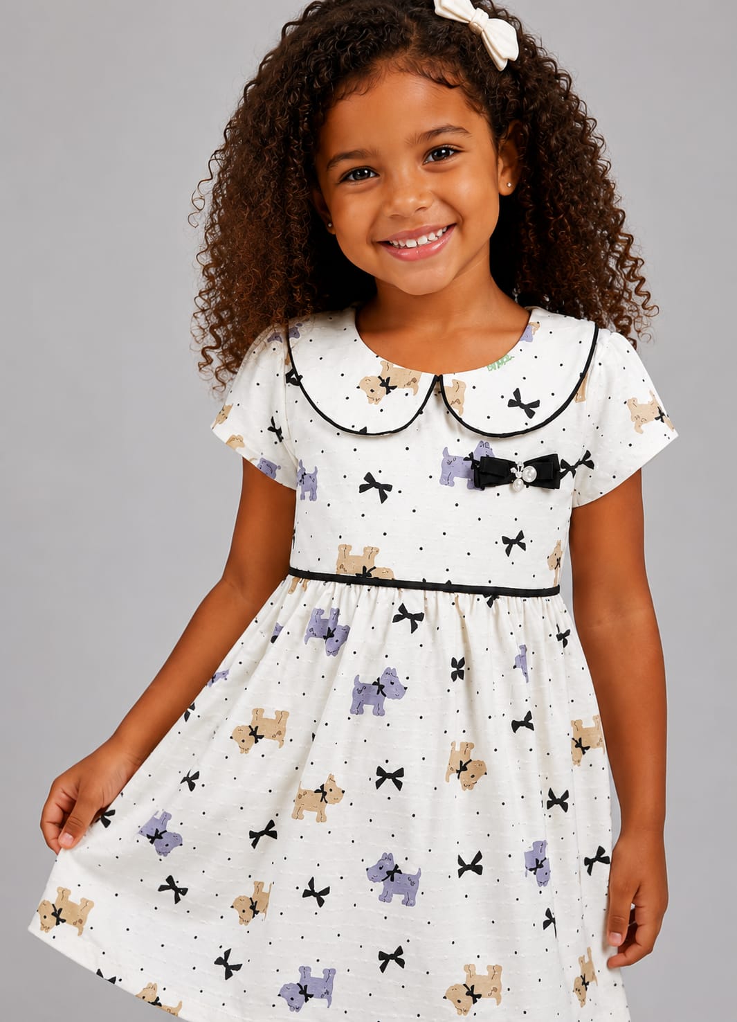 Vestido Infantil em Malha Nikko Estampado com Gola Boneca e Laço