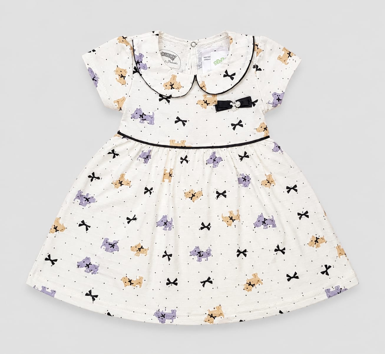 Vestido Infantil em Malha Nikko Estampado com Gola Boneca e Laço