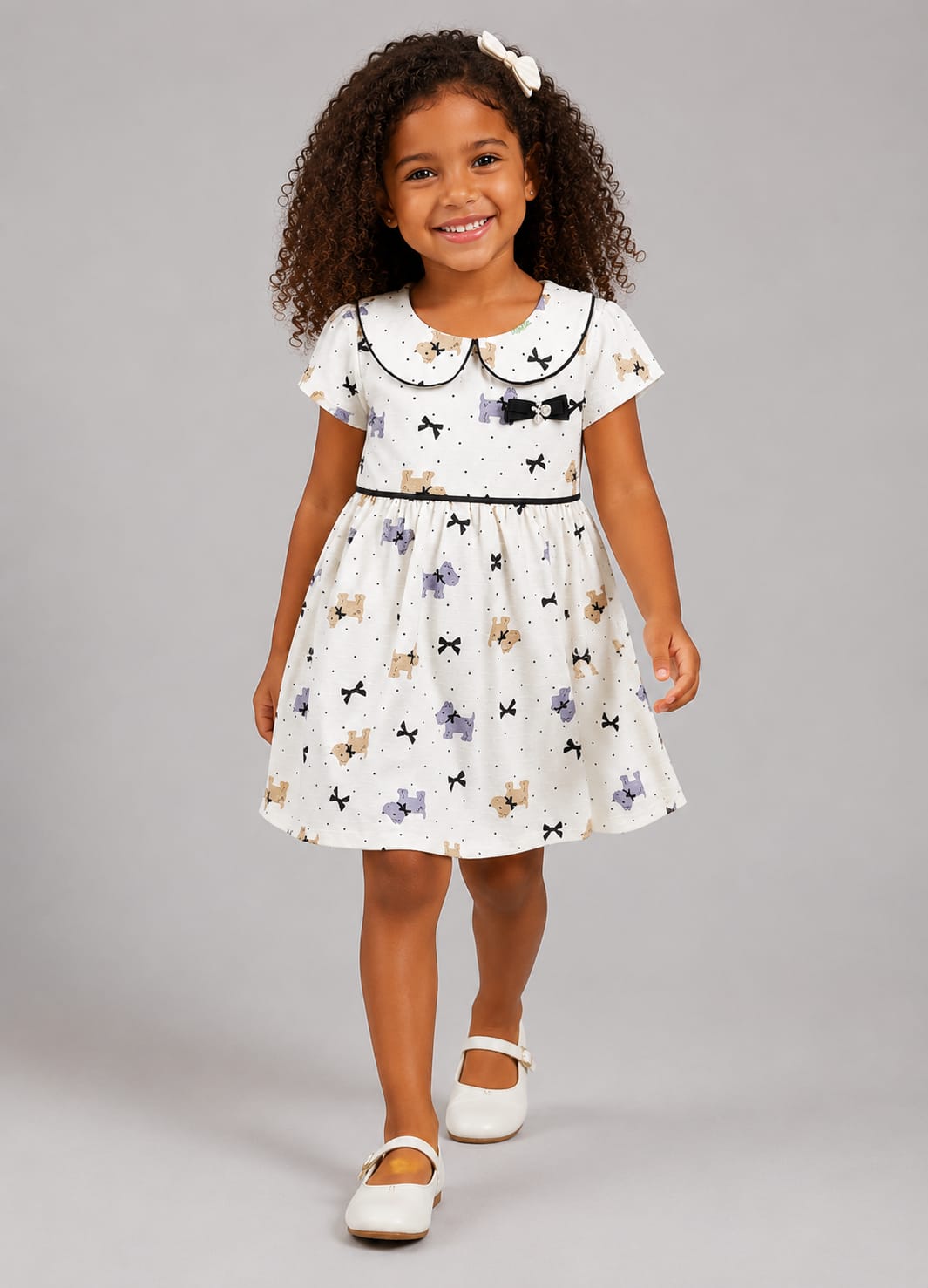 Vestido Infantil em Malha Nikko Estampado com Gola Boneca e Laço